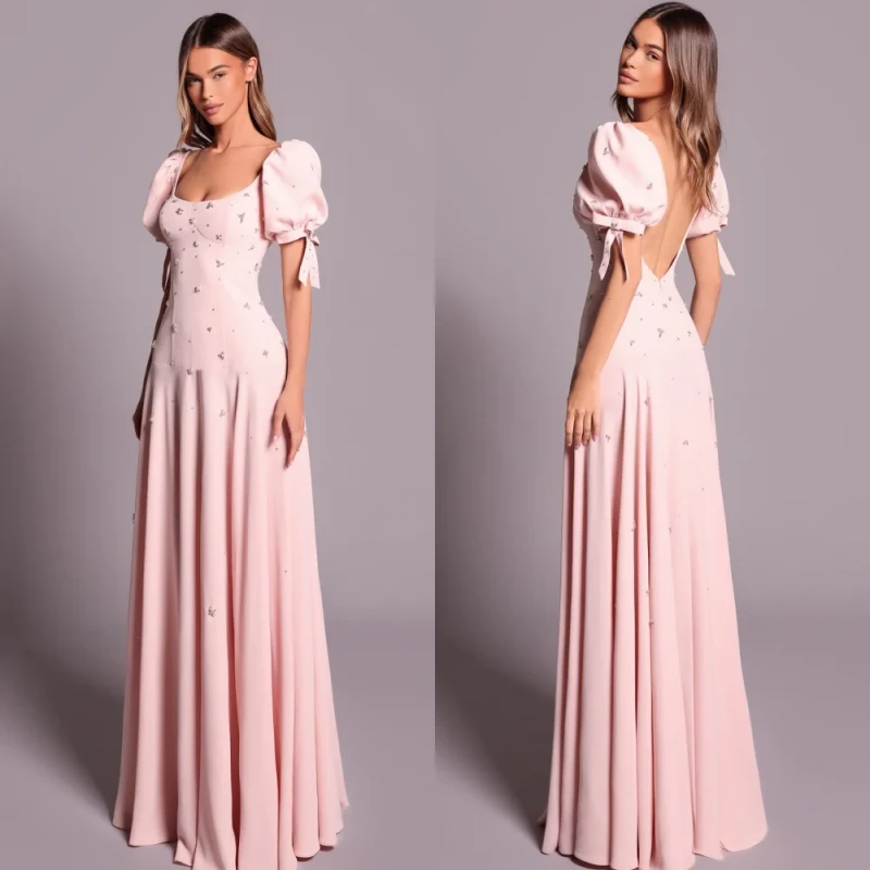 Long A-Line evening dress with square neckline and rhinestone bow detail
